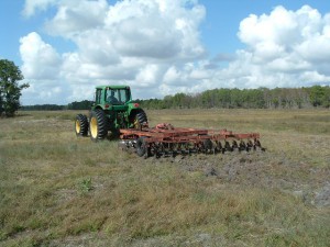 Disking former agricultural fields in early stages of restoration.